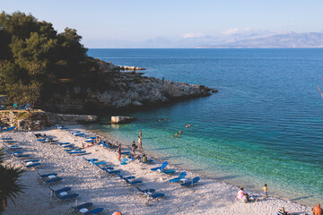Aerial view of beach in Kassiopi village in northeast coast of Corfu island, Ionian Islands, Kerkyra, Greece in a summer sunny day