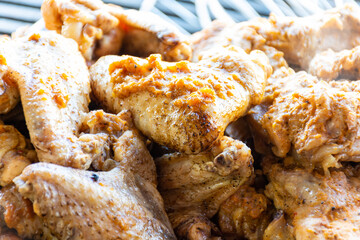 Close-up grilled chicken wings in the restaurant.