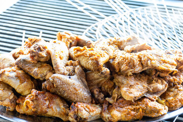 Close-up grilled chicken wings in the restaurant.