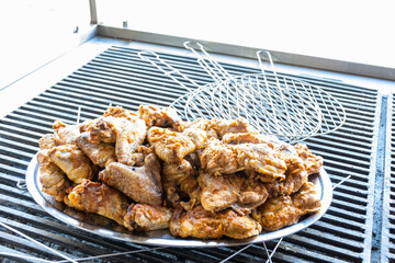 Close-up grilled chicken wings in the restaurant.