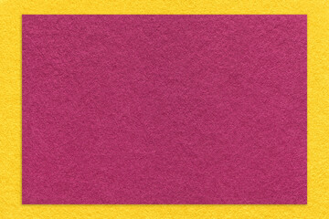 Texture of craft purple color paper background with yellow border, macro. Vintage dense kraft wine cardboard