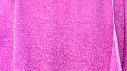 Pink texture of bath towel folded as a background