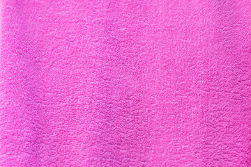 Pink texture of bath towel folded as a background