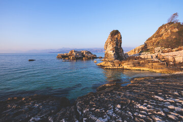 Aerial view of beach in Kassiopi village in northeast coast of Corfu island, Ionian Islands, Kerkyra, Greece in a summer sunny day