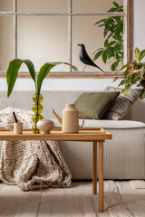 Aesthetics composition of open space interior with modular sofa, wooden coffee table, beige...