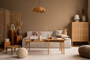 Creative composition of living room interior with modular sofa, wooden coffee table, rattan...