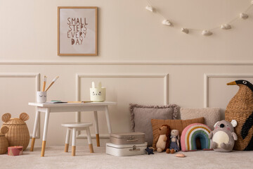 Warm and cozy kids room interior with mock up poster frame, beige wall with stucco, white desk,...