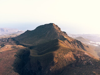 Aerial view of mountain landscape with ocean background in Roque del Conde, Arona, Tenerife.