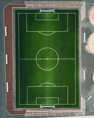 Aerial top down view of artifical grass football field.