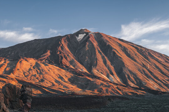 View of Teide volcano during sunrise from Roques de Garcia viewpoint in Teide National Park, Tenerife.