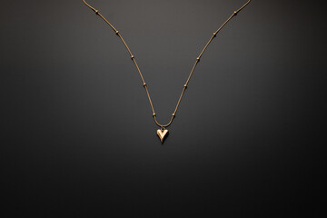 Gold jewellery necklace on black background