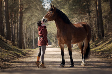 Girl with her beautiful bay horse - obrazy, fototapety, plakaty