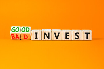 Good or bad invest symbol. Concept word Good invest and Bad invest on wooden cubes. Beautiful orange table orange background. Business good or bad invest concept. Copy space.