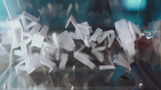 Lototron in slow motion, lototron rotation, lottery ticket shuffling in slow motion
