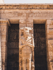 Statue with hieroglyphs in Habu Temple, Luxor, Egypt.