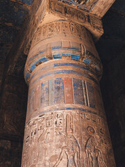Colourful column with hieroglyphs in Habu Temple, Luxor, Egypt.