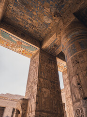 Colourful columns with hieroglyphs in Habu Temple, Luxor, Egypt.