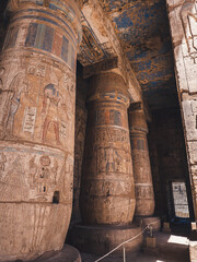 Colourful columns with hieroglyphs in Habu Temple, Luxor, Egypt.