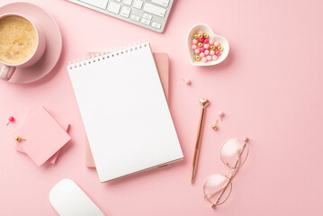 Valentine's Day concept. Top view photo of planners golden pen glasses heart shaped saucer pushpins sticky note paper keyboard and mug of coffee on isolated pastel pink background with copyspace