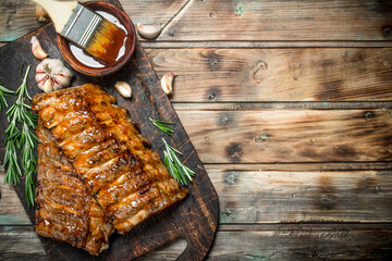 Grilled ribs with rosemary, spices and sauce.