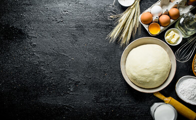 Dough background. Dough with eggs, flour and butter.