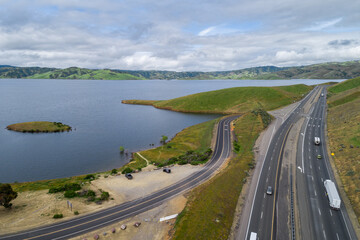 Upper Cottonwood Creek Wildlife Area. Beautiful Nature and Landscape. Green area with Cloudy Sky. Close to San Luis Reservoir. California, USA. Drone. Highway in Background
