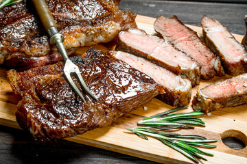 Grilled beef steak with herbs and spices.