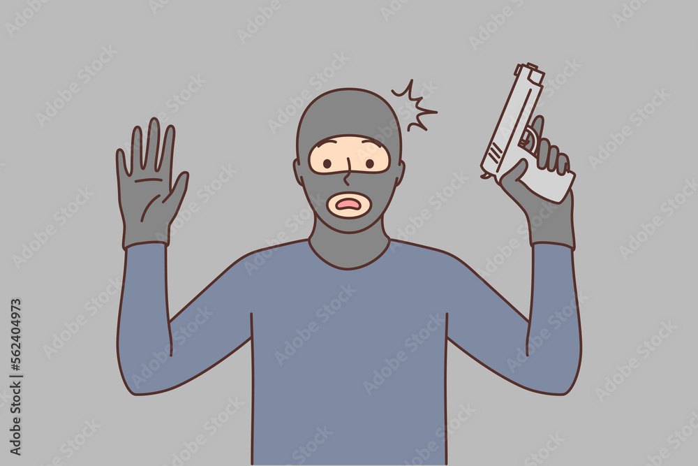 Wall mural Male robber with gun raise hands up