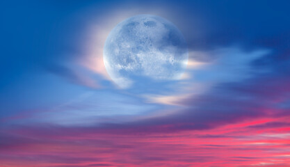 Full moon rising over empty sea at night  
