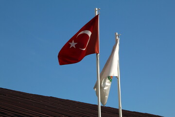 Turkish flag with a white flag with it