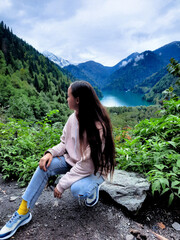 a woman in the mountains on a lake inspiration nature creativity tranquility meditation of peace relaxation rest