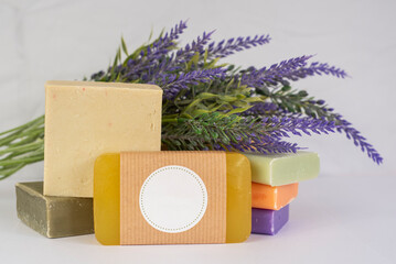 Product photograph of handmade natural organic colourful soaps decorated with fresh lavender