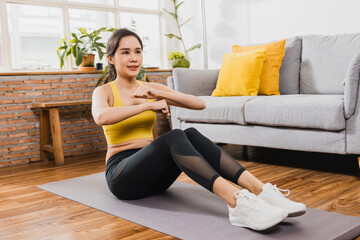 Sporty young woman, Asian female exercising with her weights in the living room