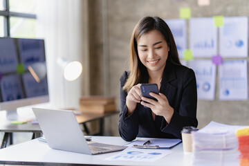 Asian businesswoman working with calculator to analyze business data and financial concept Female accountant working with computer and for business and financial expenses charming asian girl