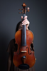 A classical violin held up