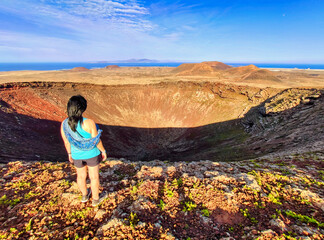 A woman on top of Calderon Hondo volcano, Fuerteventura, Canary Islands, Spain