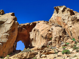 Natural stone arch eroded by wind known as Arco de las Penitas, Betancuria Rural Park, Fuerteventura, Canary Islands, Spain