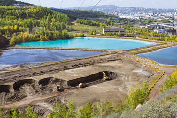 View on ash collectors of Thermal power plant in the quarry Uval Promarteli. Dirty water with...