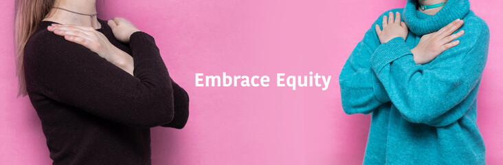 The girl hugs herself on a pink background. Concept for March 8th, #IWD2023, #EmbraceEquity,...