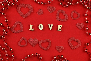 red hearts on a red background with  text Love