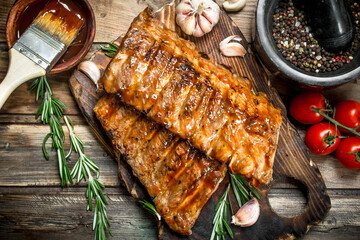 Grilled ribs with rosemary, spices and sauce.