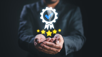 Hand shows sign of the top service Quality assurance, Guarantee, Standards, ISO certification and...