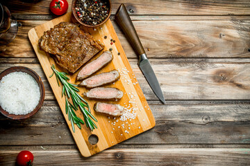 Grilled beef steak with spices and herbs.