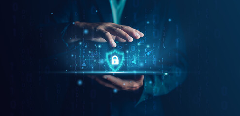 Cybersecurity and privacy concepts to protect data. Lock icon and internet network security technology. Businessman protecting personal data on tablet with virtual screen interfaces. cyber security.