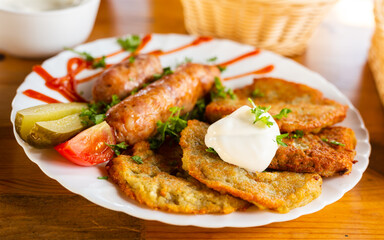 belarusian pancakes with sausages in a restaurant