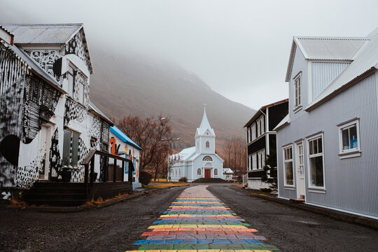 Rainbow path leading to church