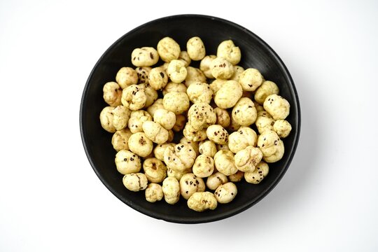 Makhana, also called as Lotus Seeds or Fox Nuts are popular dry snacks from India, served in a bowl.