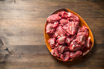 Cut raw beef on a plate.