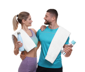 Athletic people with bottles of water and towels on white background