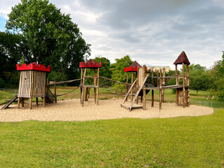Beautiful wooden children's playground on sand outdoors